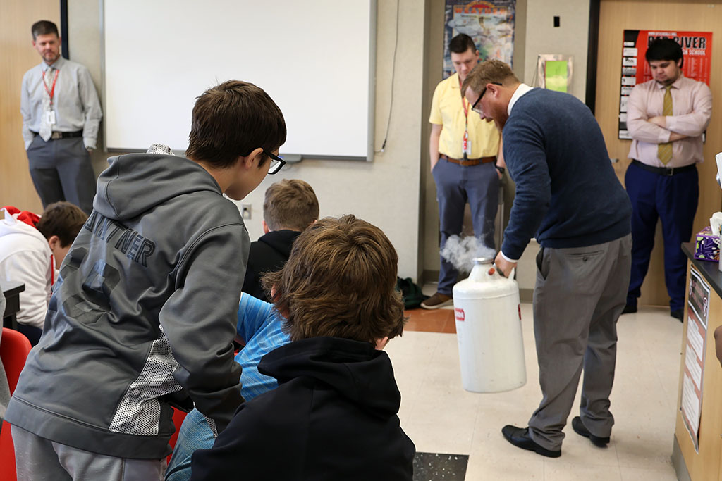 Students watch experiment