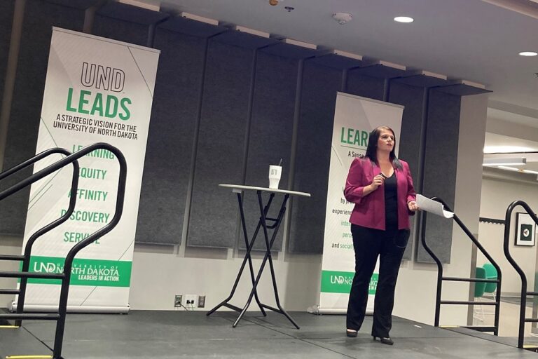 Heather Novak speaking on stage