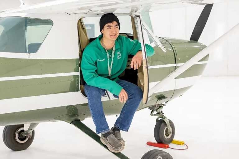 Cobi Pimental sitting on airplane