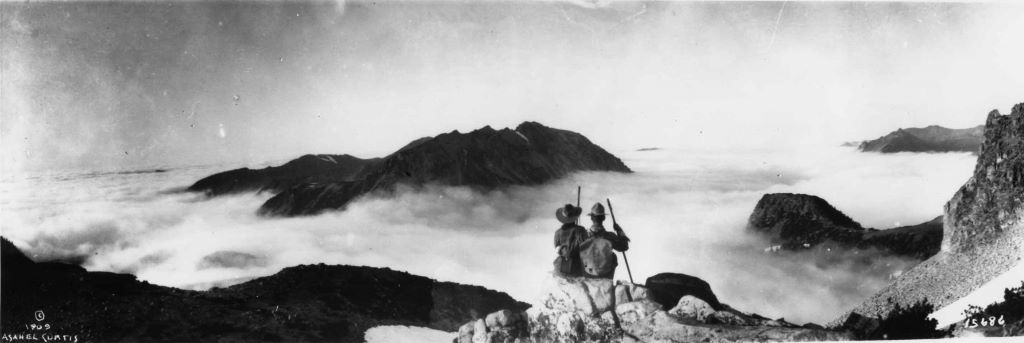 Two people sitting on summit