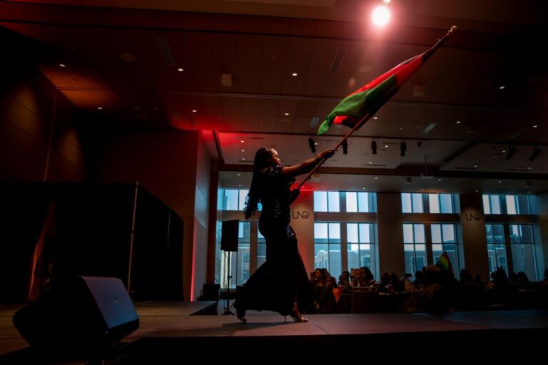 Woman waving flag on stage
