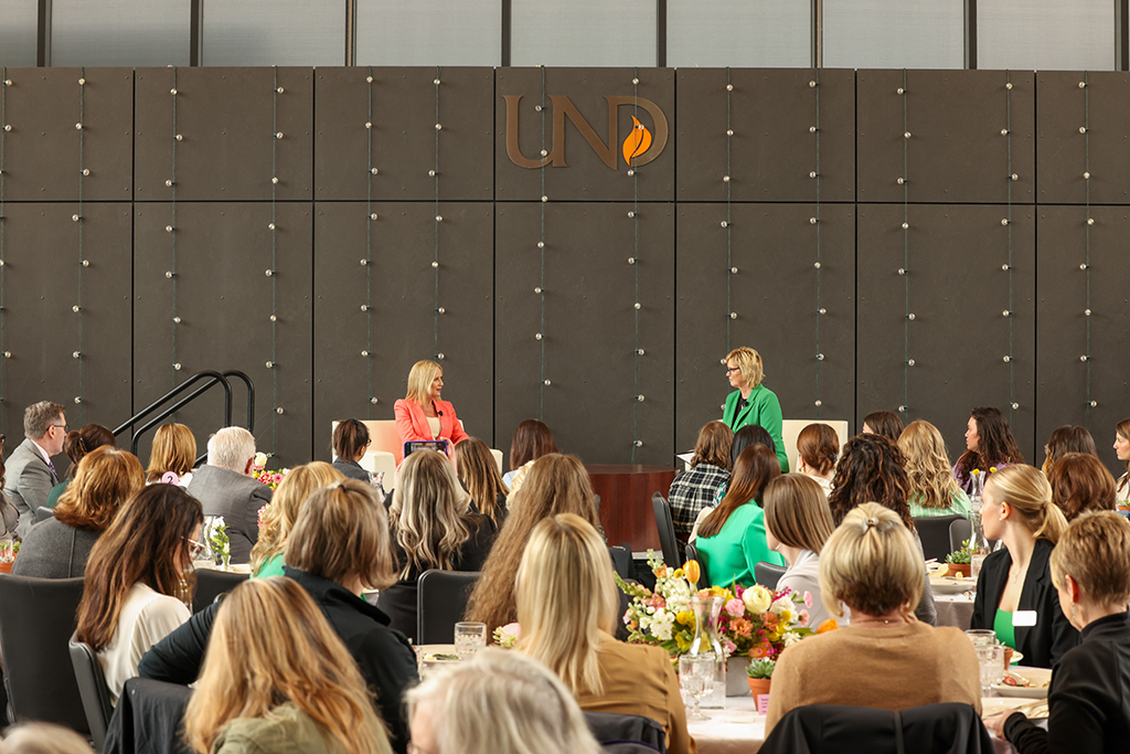 Kathryn Burgum and DeAnna Carlson Zink talking on stage