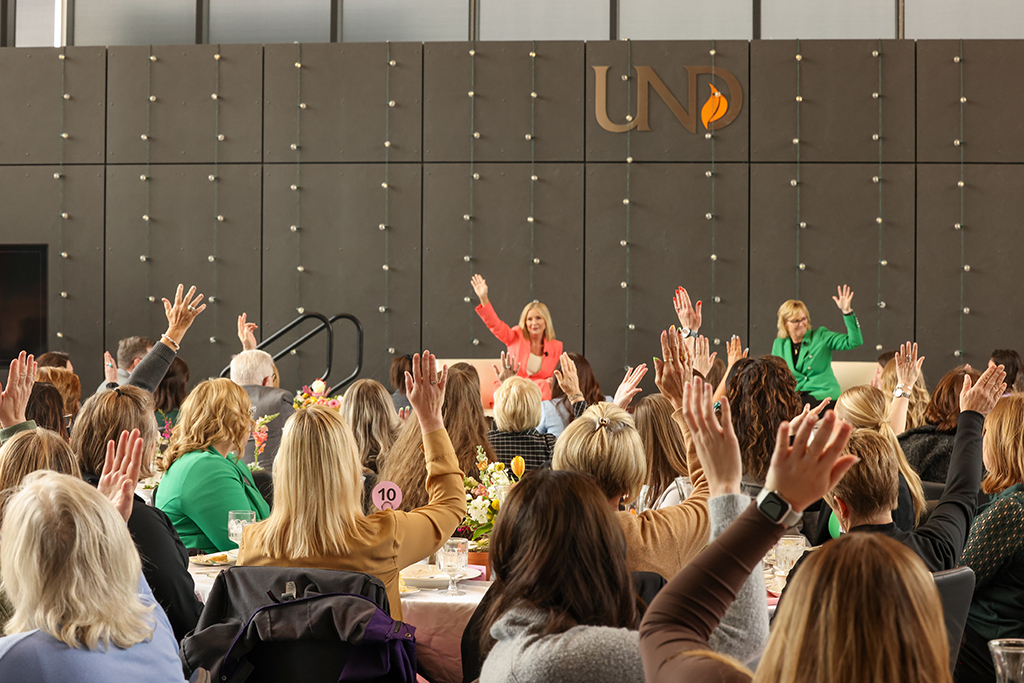 Guests raising hands