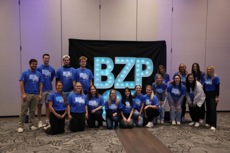 Students pose in Blue Zones Project shirts
