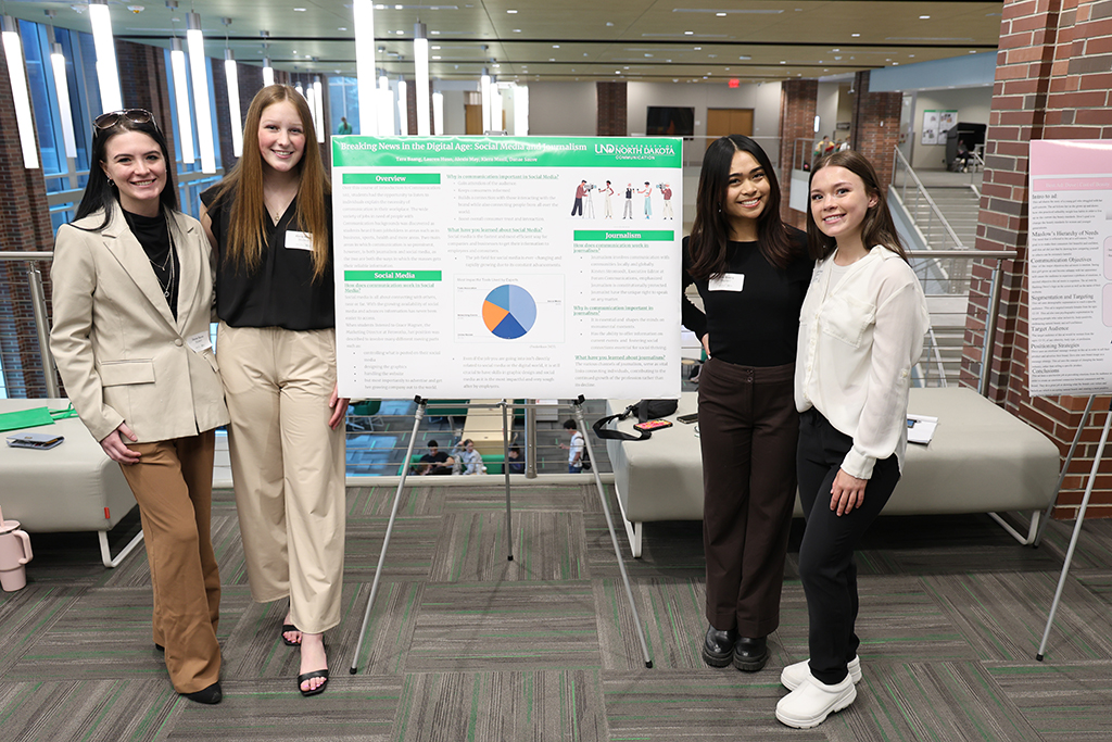 group standing at a poster
