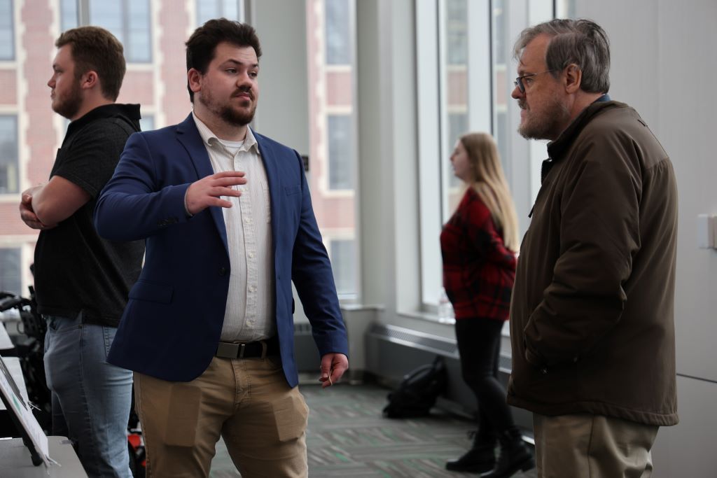 Student talking with faculty