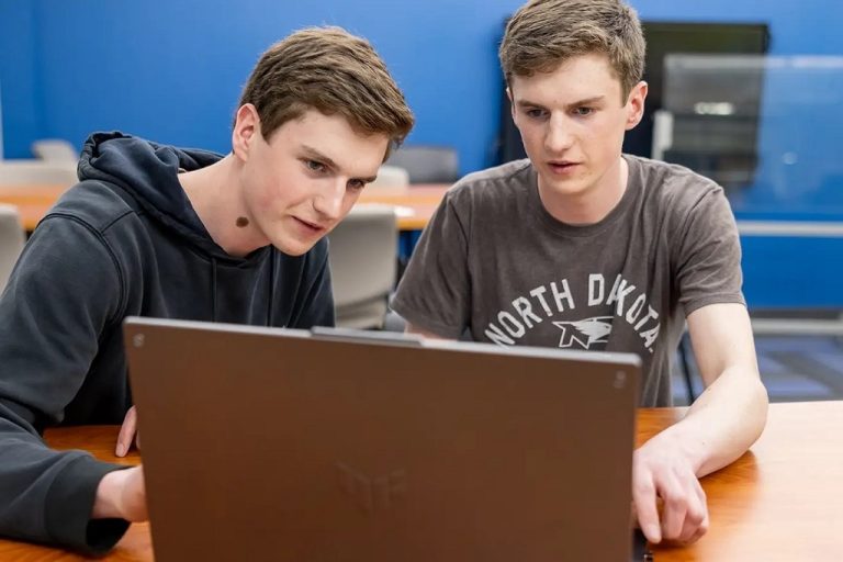 Ryan and John Bergum at laptop