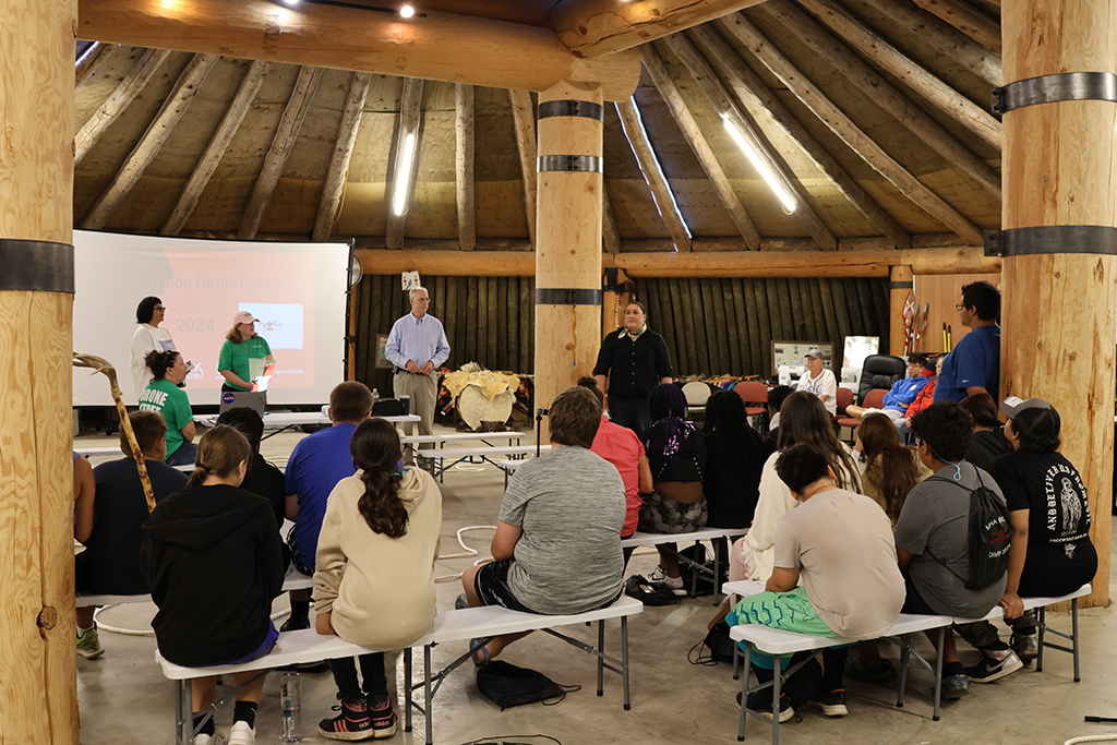 children listening to a speaker