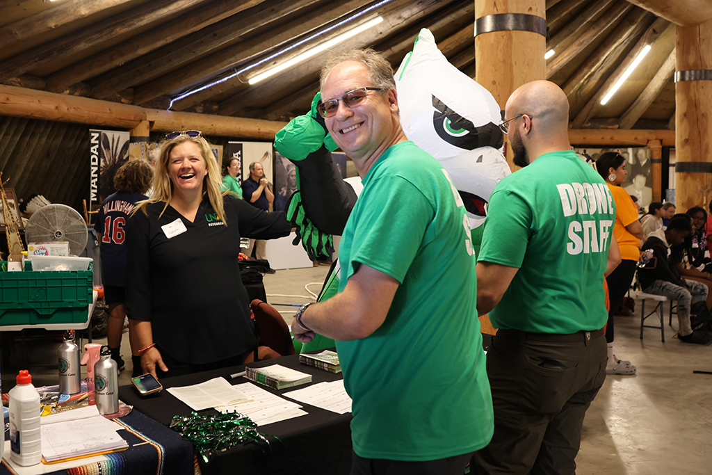 man and woman smile at the camera