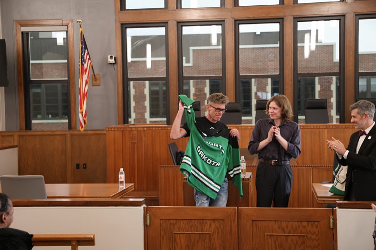 Judge Igor Tuleya holds UND hockey jersey
