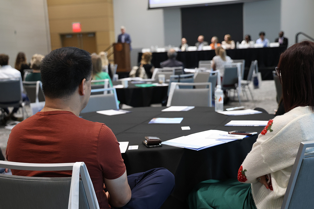 Guests listen to speakers at Fulbright event.