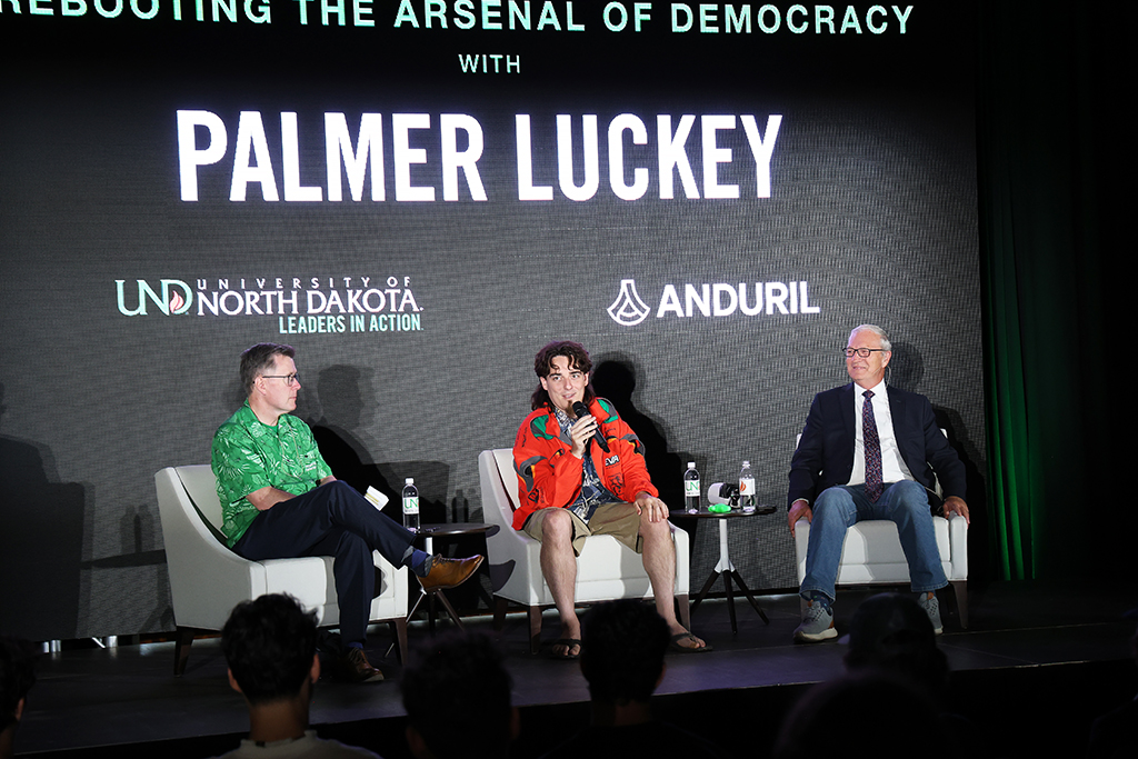 Armacost, Luckey and Cramer on stage.