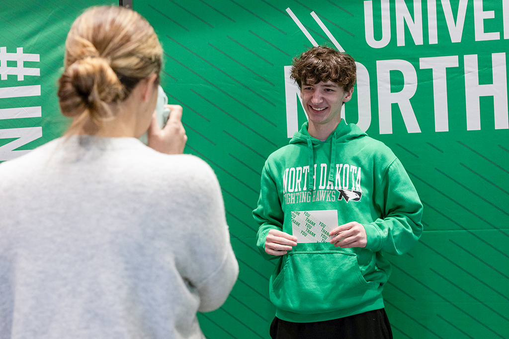 Student gets picture taken at Notes from the Nest