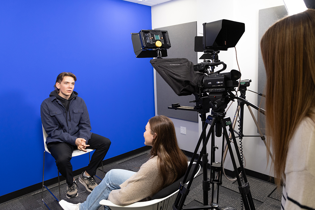 Students with blue screen