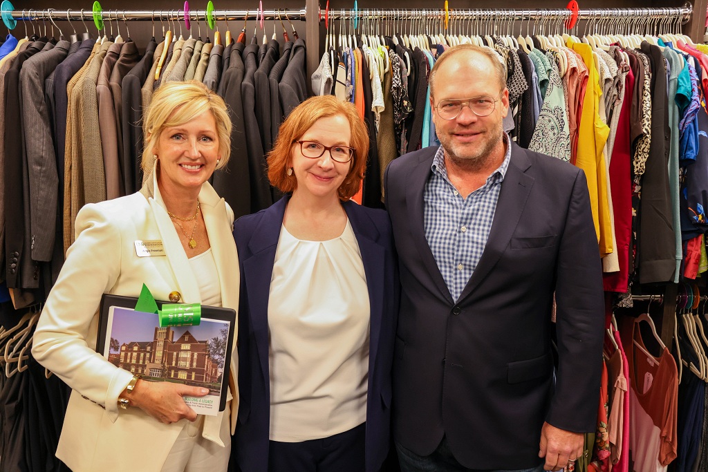 Angie Freeman, ’91; Pancratz Career Development Center Director Kathy Lund, ’15; and Russ Freeman, ’89, stand in the Freeman Professional Closet at UND.