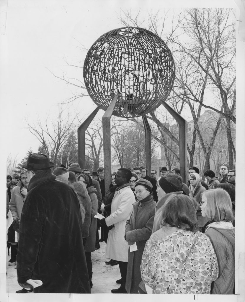 Photo of people marching for Civil Rights near the Eternal Flame on UND's campus