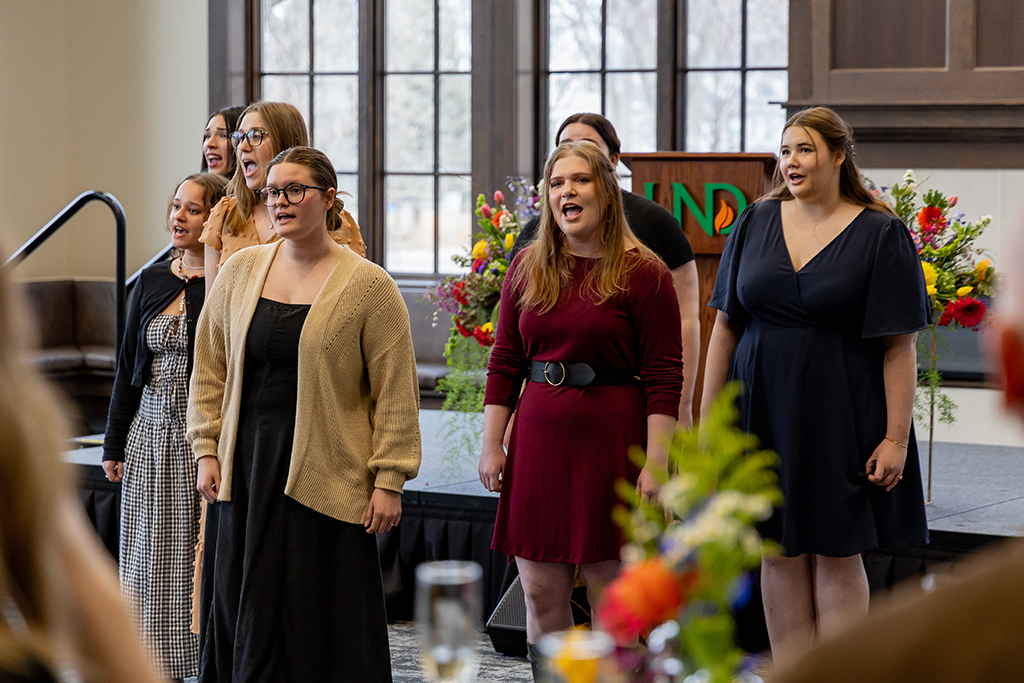 University students singing as a group