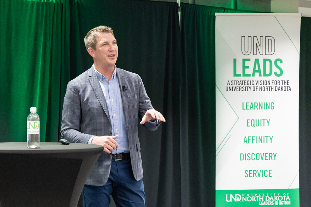 Joshua Deere on stage for 18:83 Speaker Series