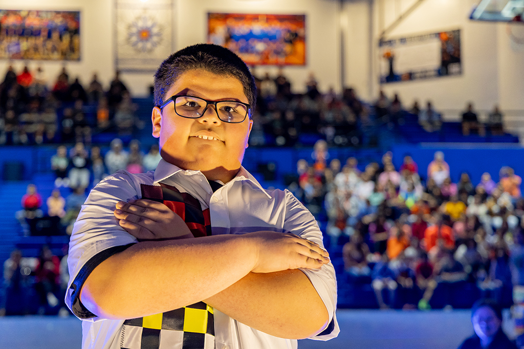 Boy models ribbon shirt in Native tradition