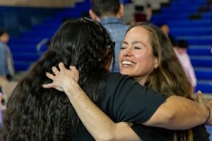 Lorena Fox-White and Julie Robinson hug.