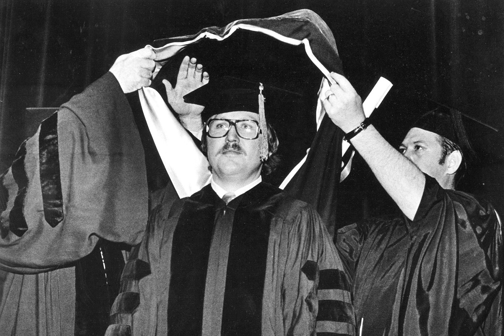 Dr. Robert Arusell (M.D. ’76) gets presented with his doctoral stole in 1976.