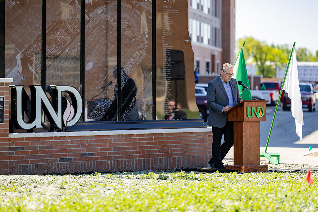 Steve Burian speaks at the monument dedication ceremony