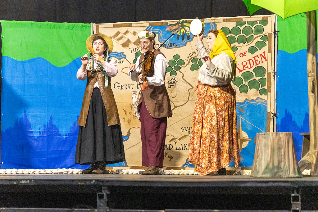 Actors on stage of Shakespeare event.