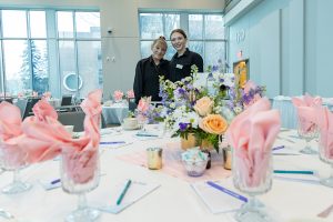 Veteran Catering Supervisor Karen Bushaw (left) and student manager Amelia Acker prep for a full-service plated event.