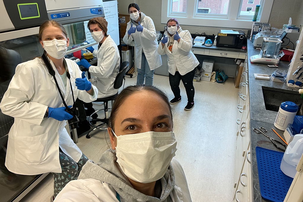 UND Forensic Science Director Lavinia Iancu works in the high-tech lab with a group of her students.