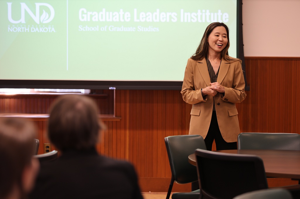 Soojung Kim addresses group