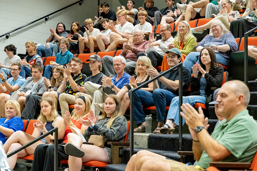 The audience claps at music therapy event