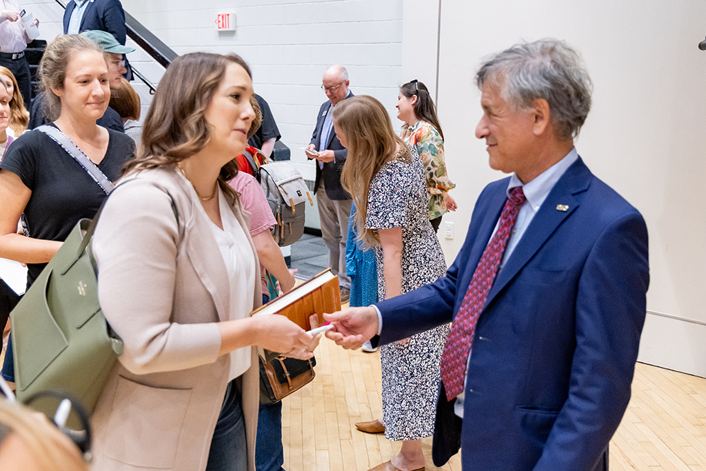 Dr. Daniel Levitin greets guests and signs his books after his lecture.