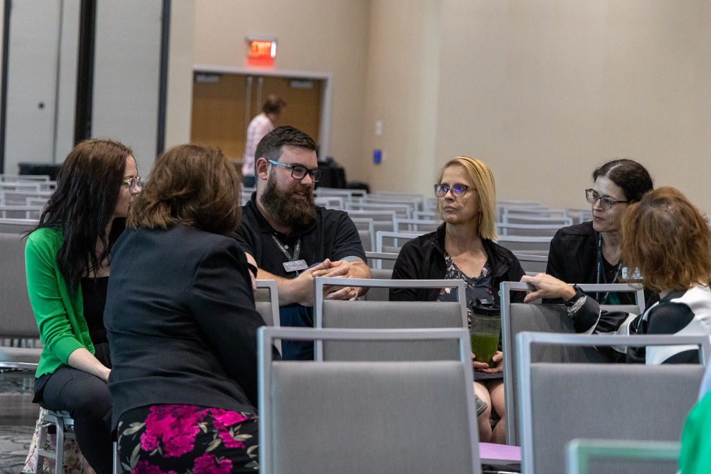 staff and faculty talk in audience