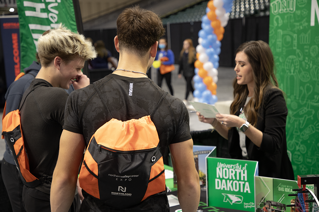 Sarah Glimsdahl, assistant director of application processing at UND, speaks with area high school students at the 2025 Northern Valley Career Expo.