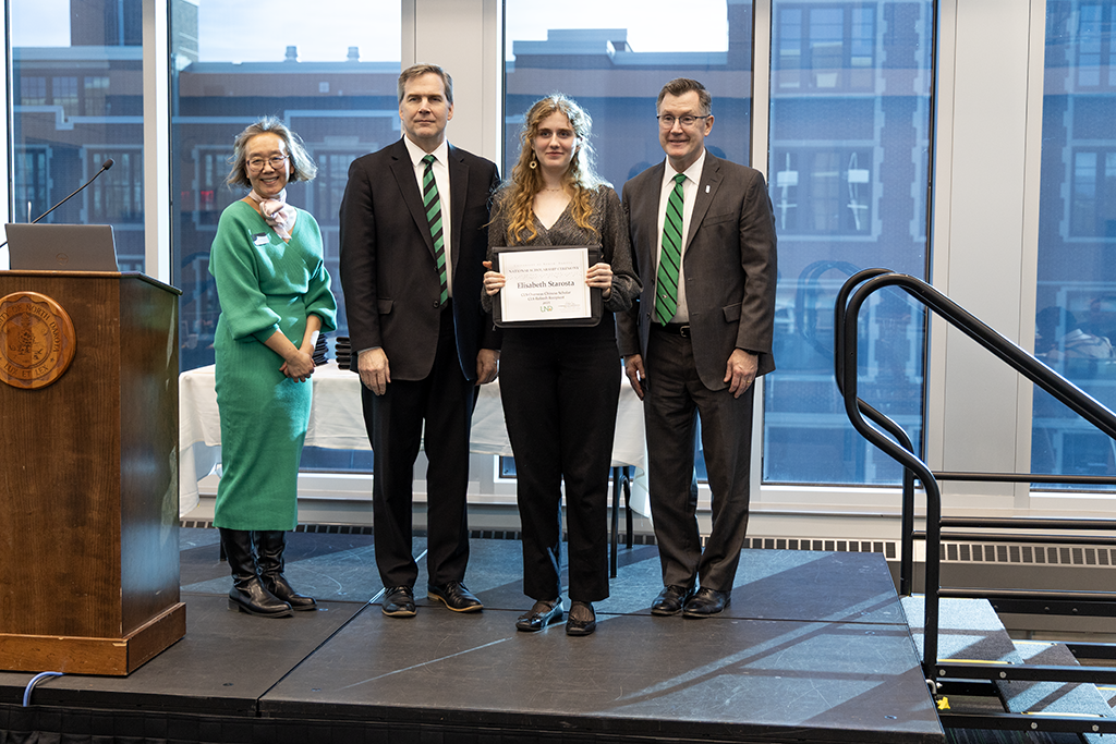 UND president posing with scholarship awardee