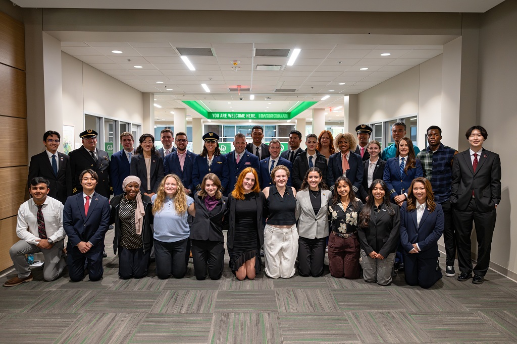 Faces of the Industry Student Planning Committee poses with speakers from the event
