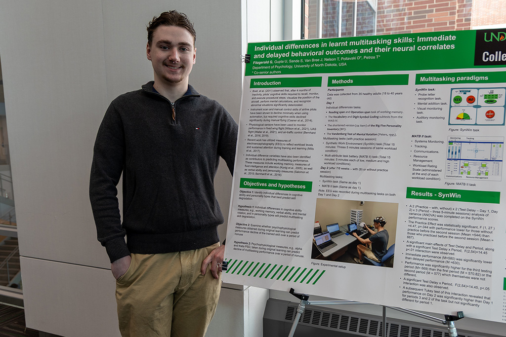 gavin Fitzgerald next to poster