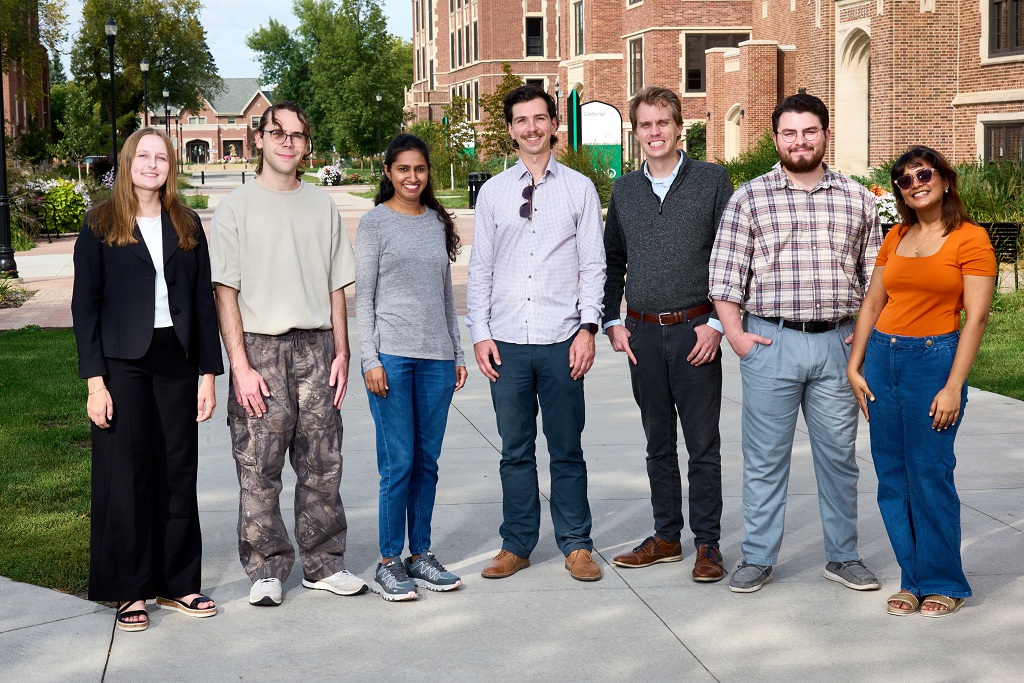 Members of the Quantum Optics Research Group pose on the UND campus.