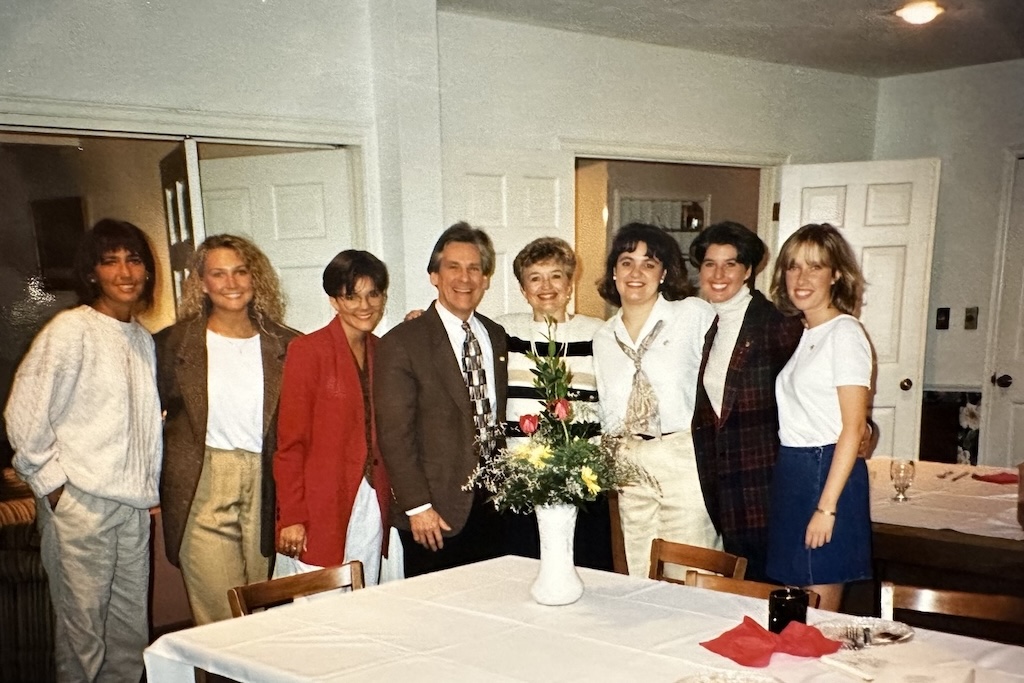 President Ken and First Lady Toby Baker pose after dinner with members of a UND sorority