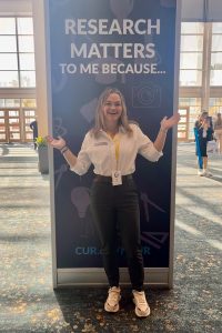 paige jones standing in front of sign