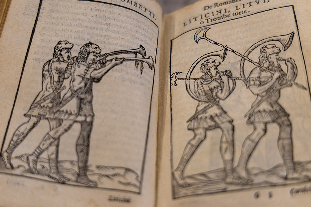 black-and-white illustration of soldiers blowing horns and marching