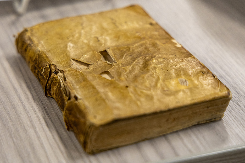 close-up of a small 16th-century book resting on a table
