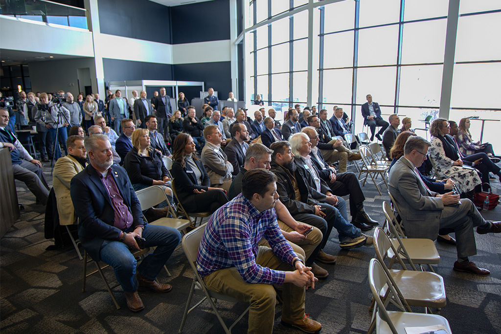 crowd listening to speeches about live FAA radar data at UND