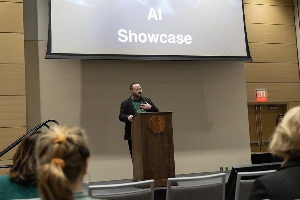 man speaks at podium