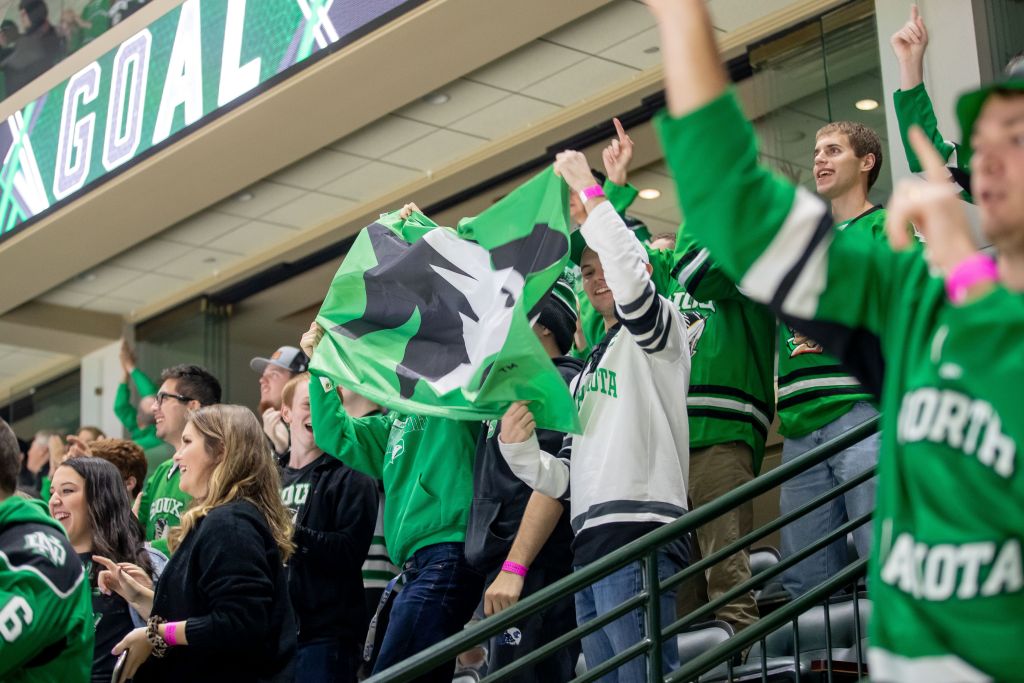 UND hockey fans enjoy a regular celebration after the home team scores a goal at Engelstad Arena in Grand Forks.
