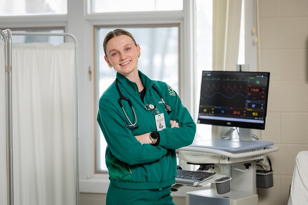 UND nursing student stands in a clinic room