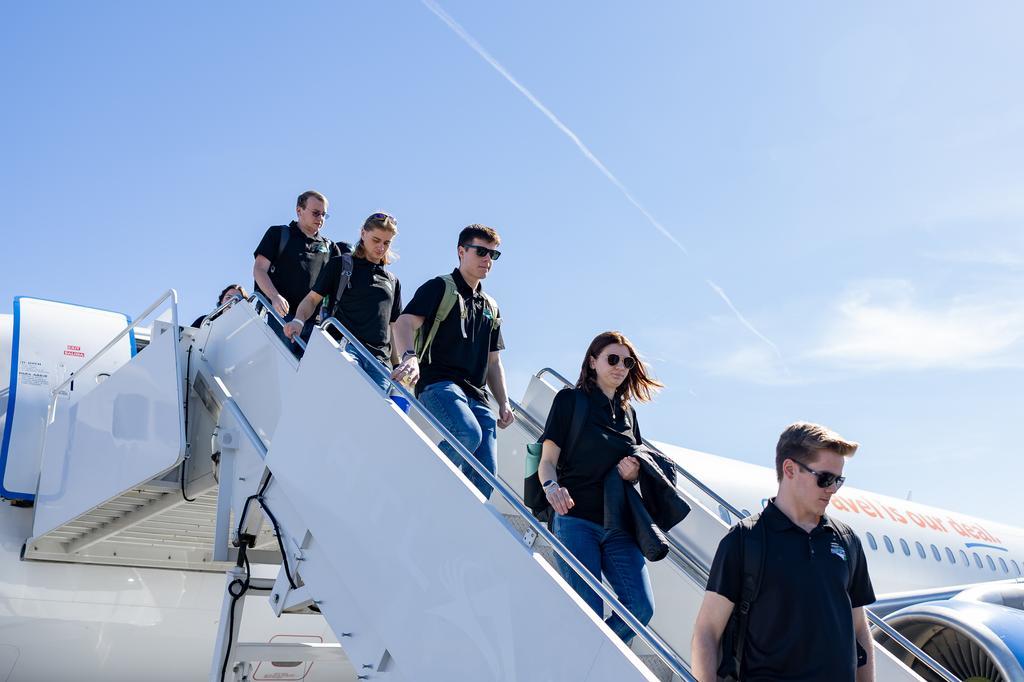 pride of the north band members getting off plane