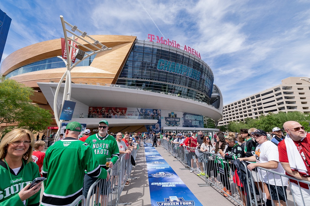 Approach to T-Mobile Arena, lined with fans.