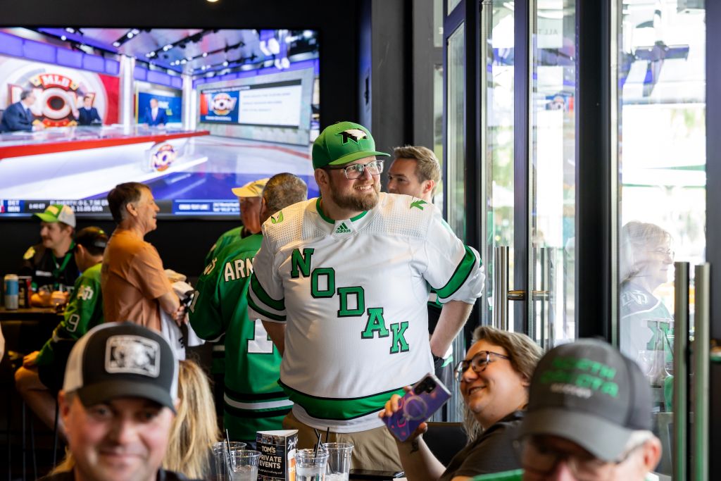 UND hockey fans revel at Tom's Watch Bar for a semifinal pregame party.