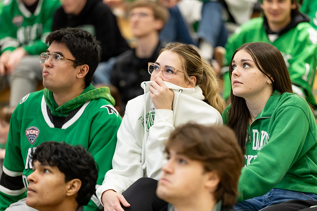 A woman covers her face 